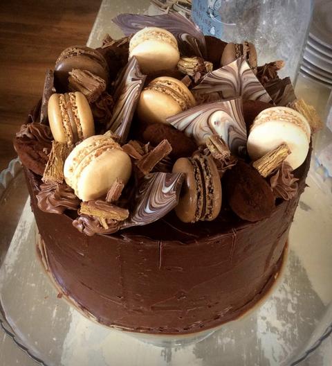 Chocolate cake topped with macaroons, marble chocolate shards & dark chocolate truffles